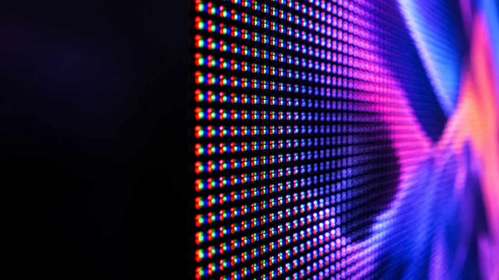 Close-up of an LED display module showing rows of red, green and blue pixels at a fixed pixel pitch